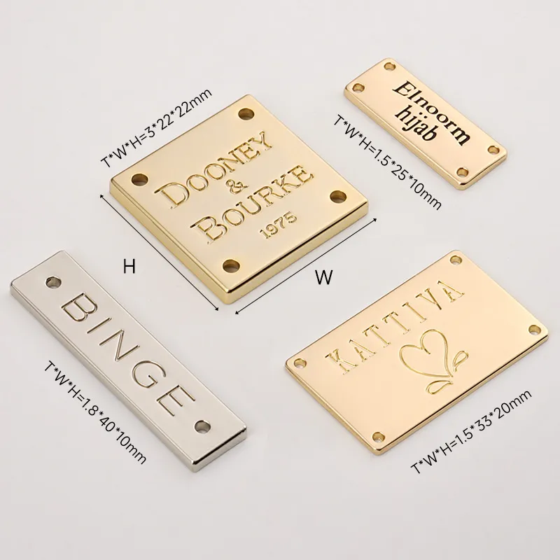 golden silver metal clothing tag with sewing holes