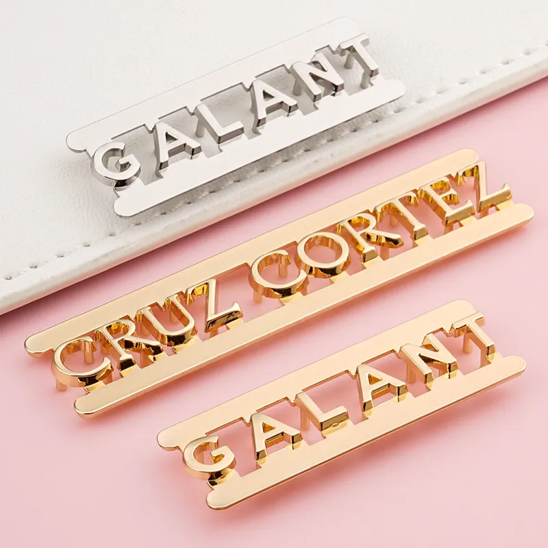 metal letter logo in silver and gold for bags