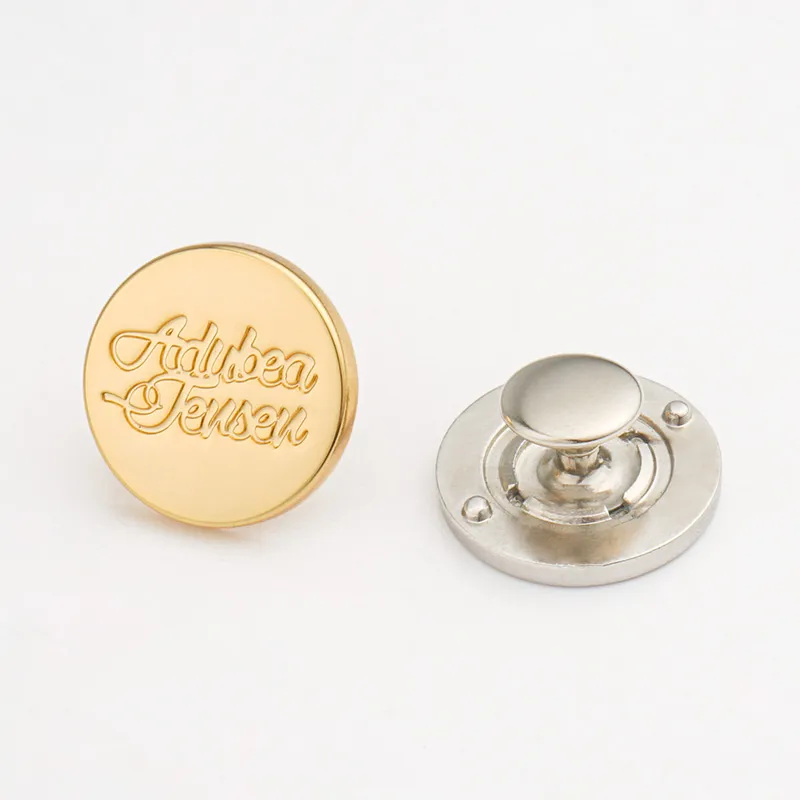 metal name tag with engraved logo in gold and silver