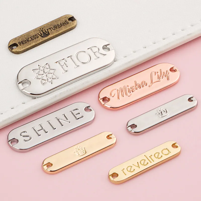 sewn metal clothes tag with engraving logo for garment