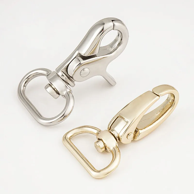 silver metal trigger hook and gold spring hook